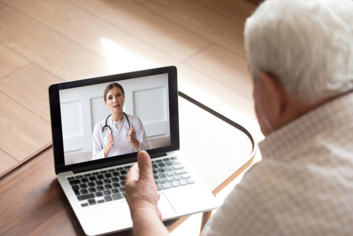 Man speaking with nurse on video call