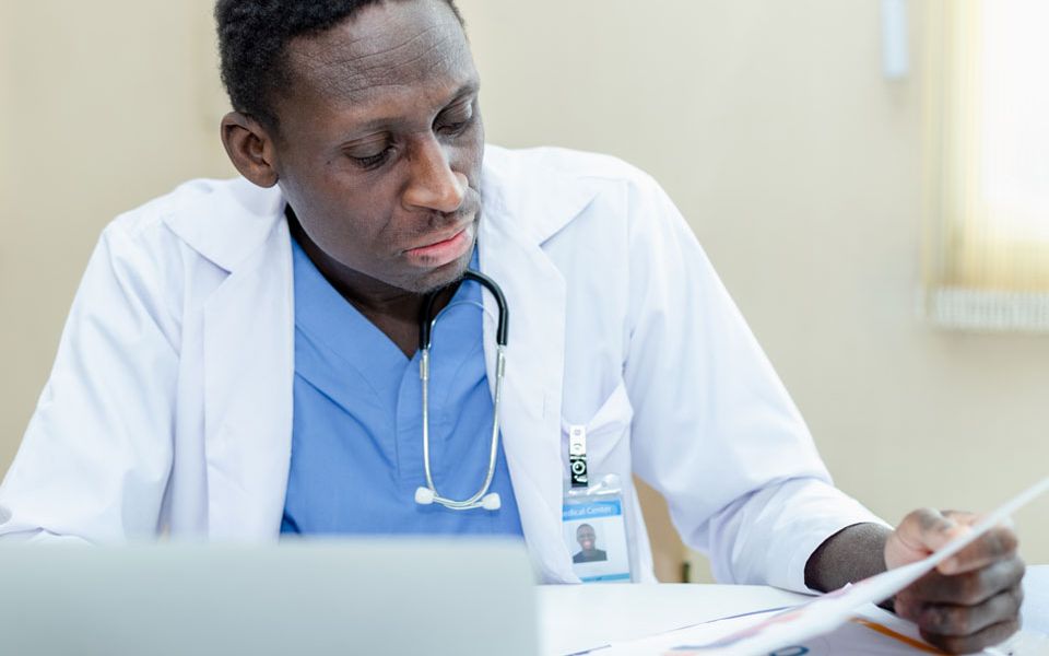 doctor looks over records