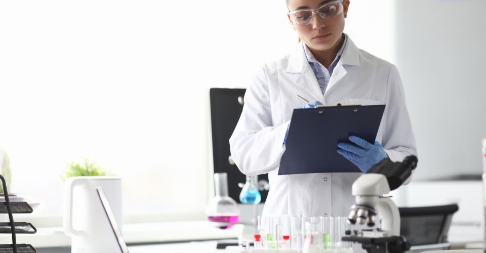 Scientist completing documents in laboratory