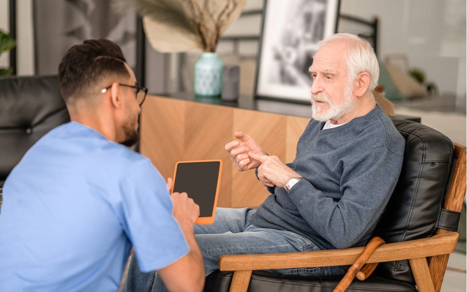 doctor shows patient information on tablet