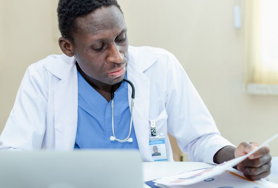 doctor looks over records