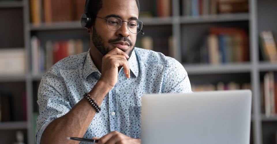 man looking at laptop