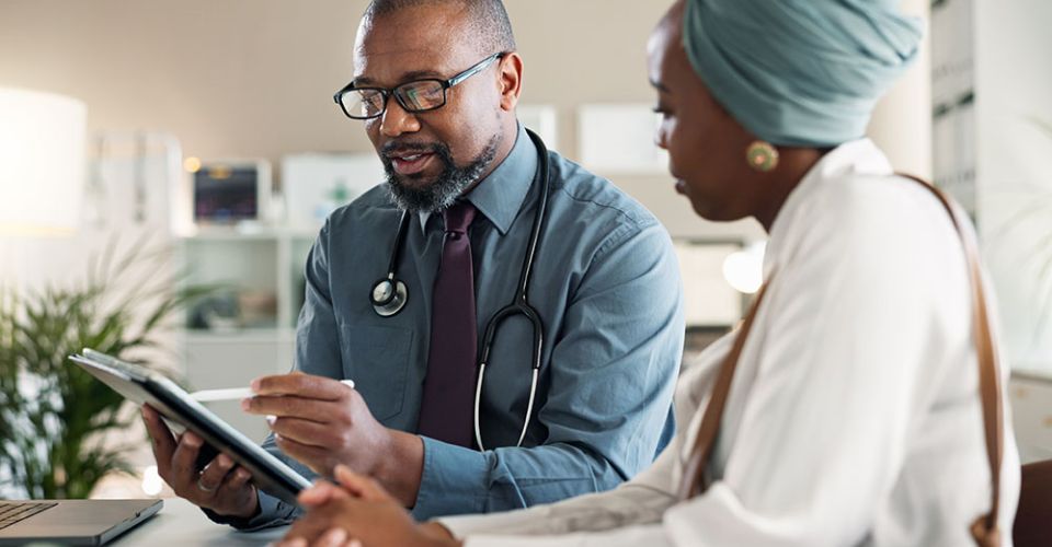 doctor speaking with patient