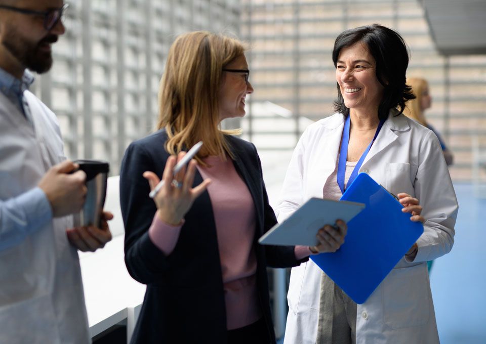 scientists discuss in hallway