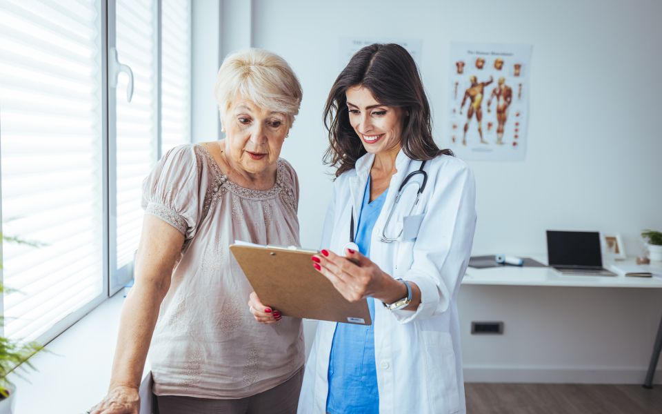 woman looking at clipboard