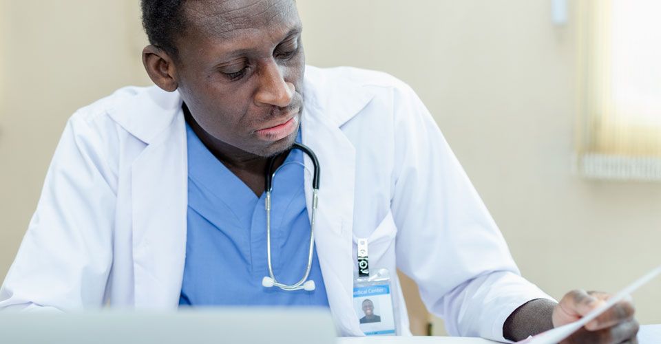 doctor looks over records