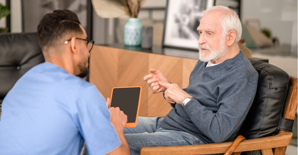 doctor shows patient information on tablet