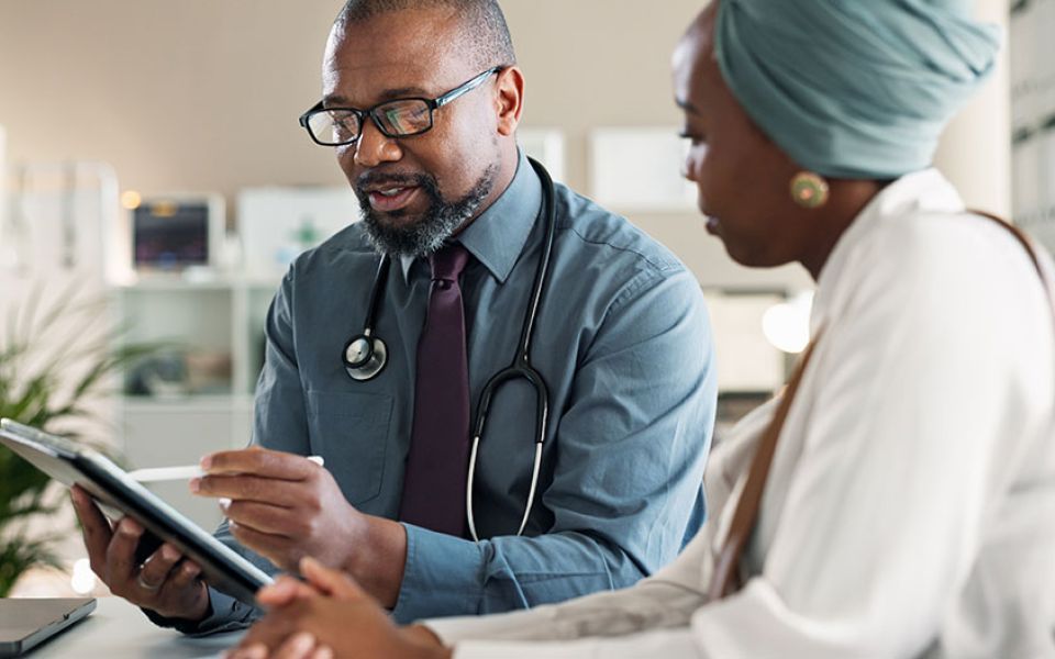 doctor speaking with patient