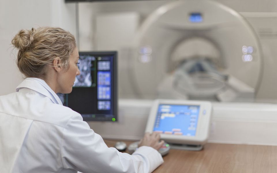 Medical employee working on device