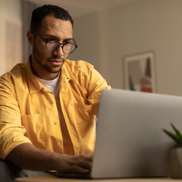 man looking at laptop