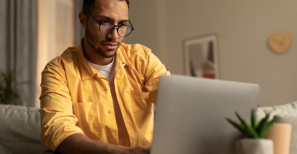 man looking at laptop