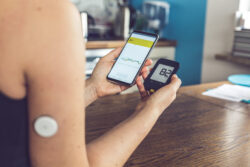 Woman check health statistics during a decentralized clinical trial, where localization of instructions is vital